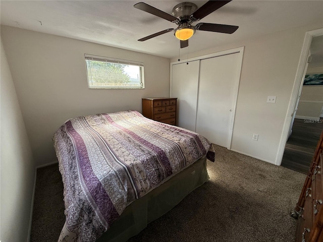 carpeted bedroom with ceiling fan and a closet