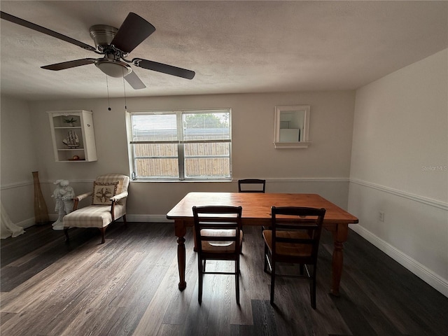 dining room with ceiling fan and dark wood-type flooring