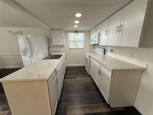 kitchen with white appliances, sink, white cabinets, and light stone counters