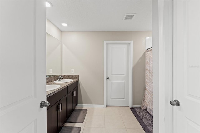 bathroom featuring tile patterned floors, vanity, and a shower with shower curtain