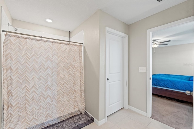 bathroom featuring a shower with curtain, tile patterned floors, and ceiling fan