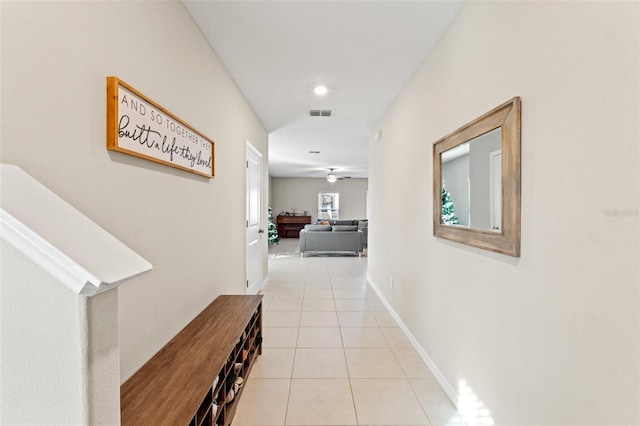 hall with light tile patterned floors