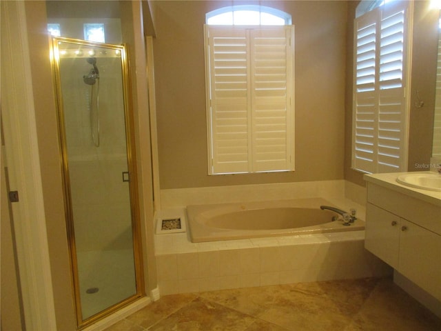 bathroom featuring vanity, tile patterned floors, and independent shower and bath