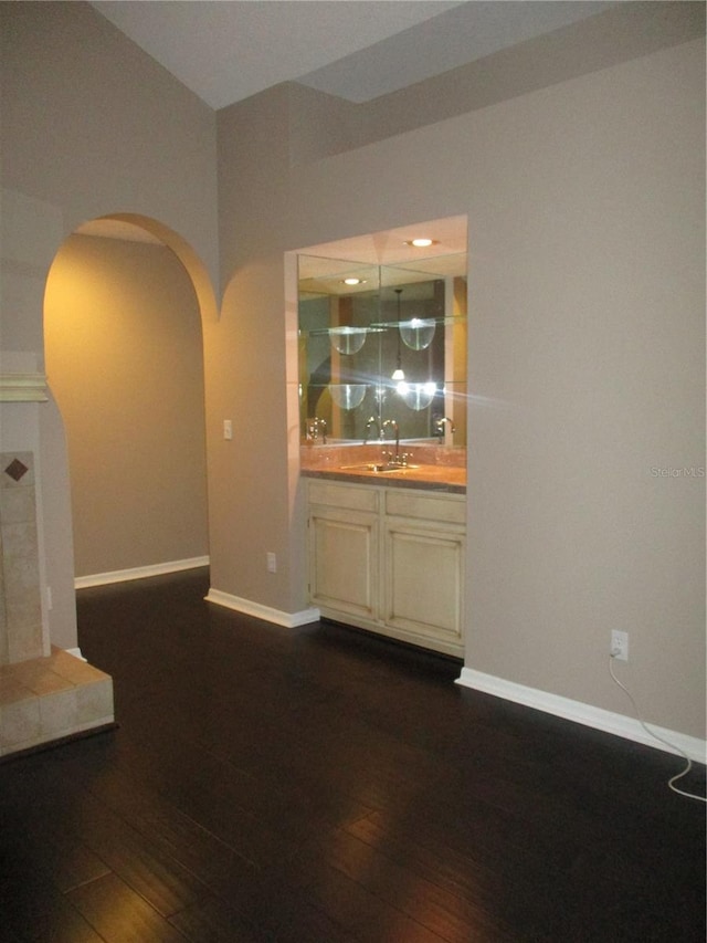 interior space with dark hardwood / wood-style floors and sink