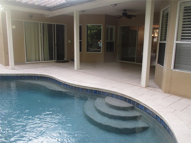 view of pool featuring ceiling fan and a patio area