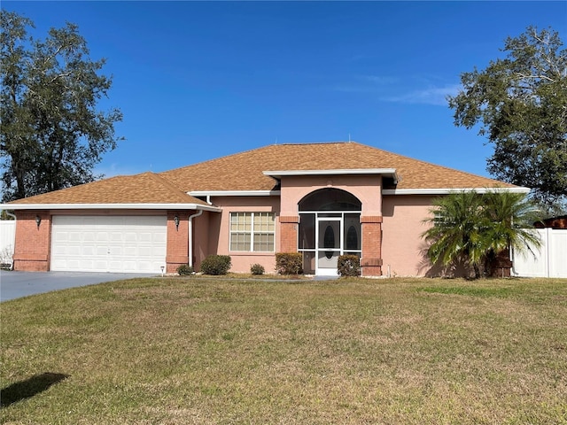 ranch-style house featuring a garage and a front lawn