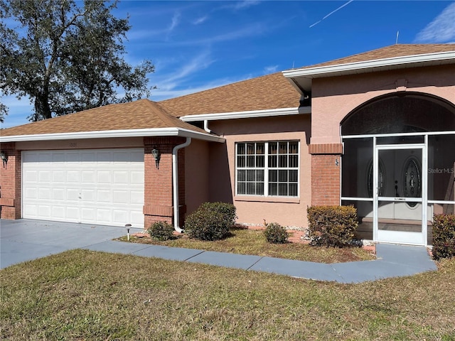 view of front of home with a garage and a front lawn