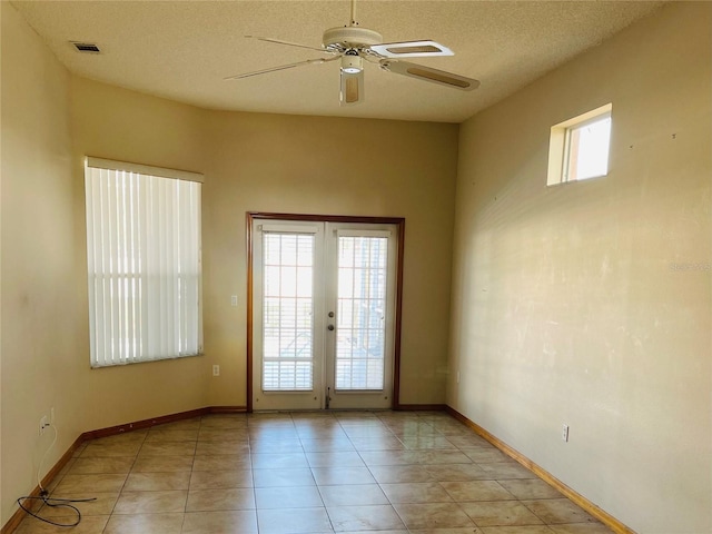 doorway to outside featuring french doors, a textured ceiling, light tile patterned floors, and ceiling fan