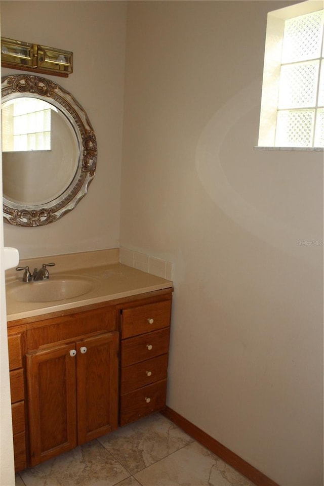 bathroom with tile patterned floors and vanity