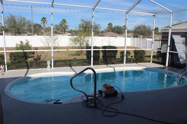 view of pool with a lanai