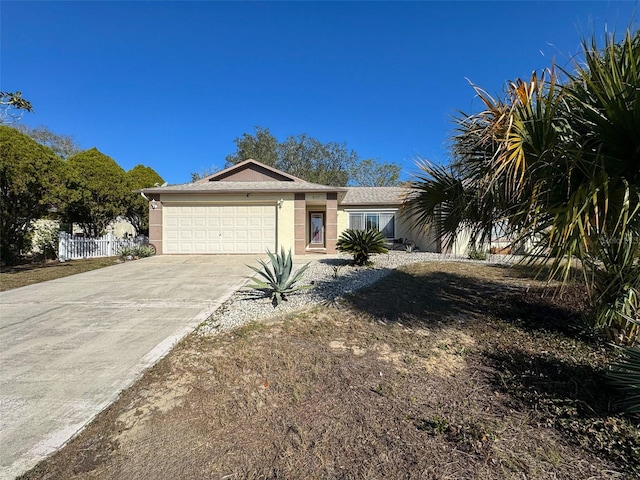 single story home featuring a garage