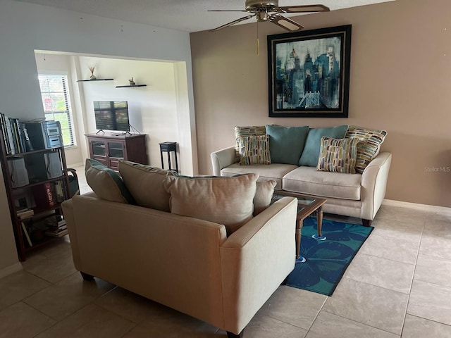 living room with tile patterned floors and ceiling fan