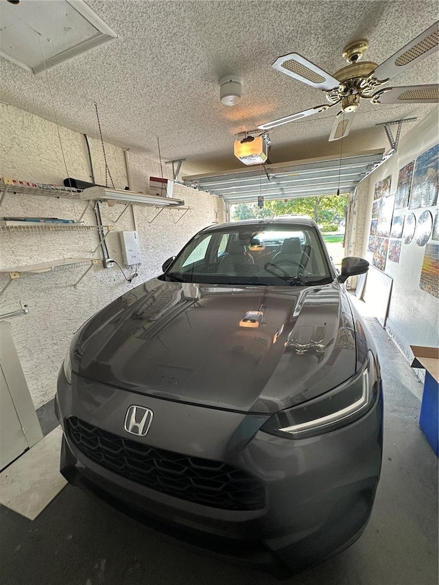 garage with ceiling fan and a garage door opener