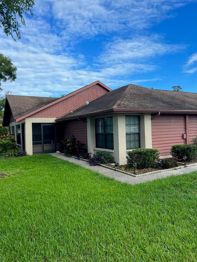 view of property exterior with a yard