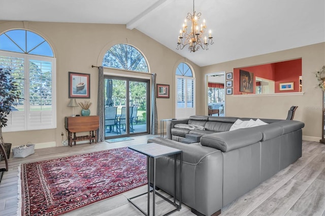 living room featuring vaulted ceiling with beams, light hardwood / wood-style floors, and a chandelier