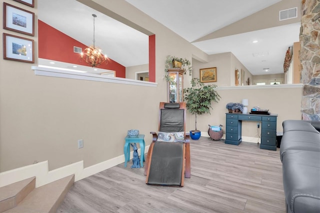 living room featuring light hardwood / wood-style flooring, high vaulted ceiling, and a chandelier