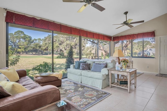 sunroom / solarium featuring ceiling fan, a healthy amount of sunlight, and vaulted ceiling