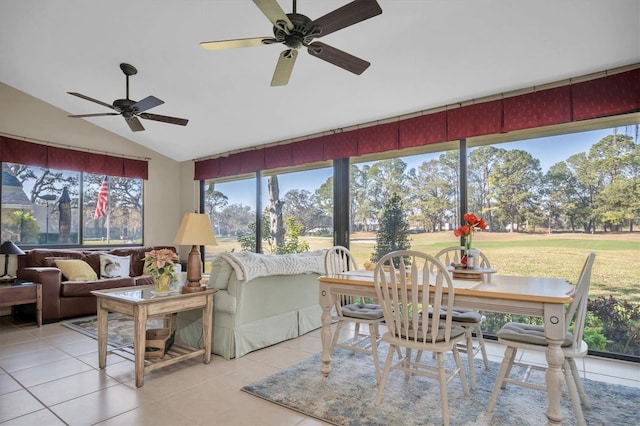 sunroom with ceiling fan and vaulted ceiling