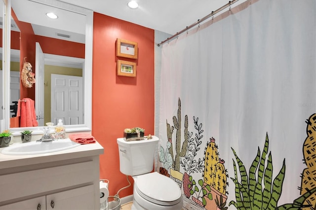 bathroom with vanity and toilet