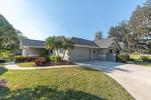 ranch-style house featuring a front yard and a garage