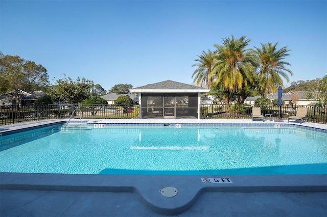 view of pool with a sunroom