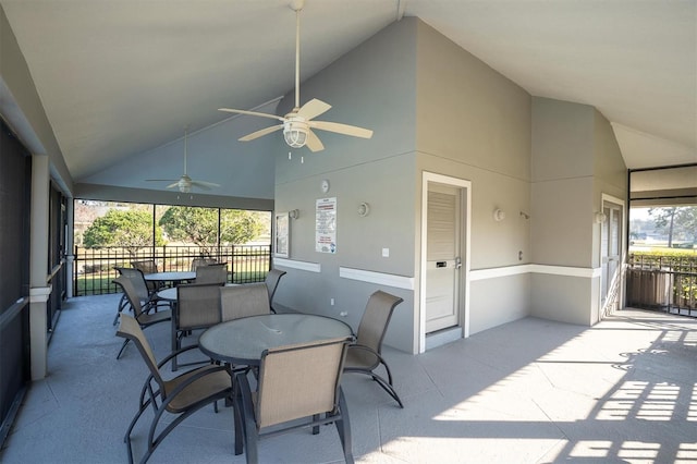 sunroom featuring vaulted ceiling, a wealth of natural light, and ceiling fan