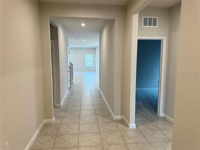 hallway with light tile patterned floors