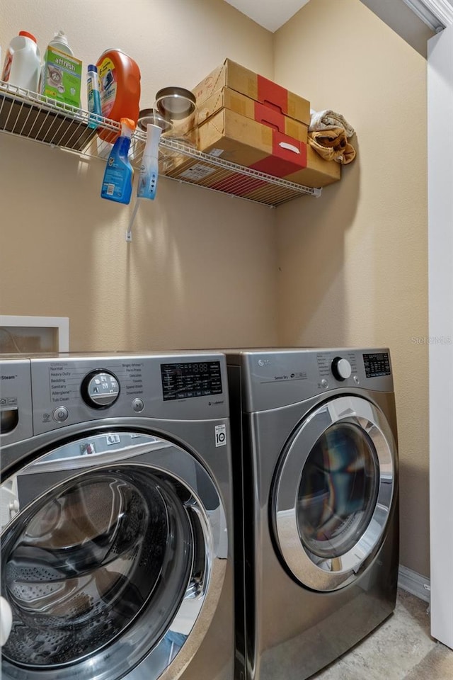 washroom featuring washing machine and dryer