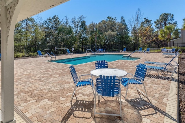 view of pool featuring a patio