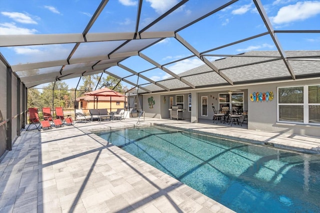 view of pool featuring a patio area and a lanai