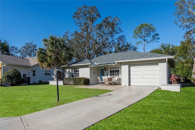 ranch-style home featuring a garage and a front yard