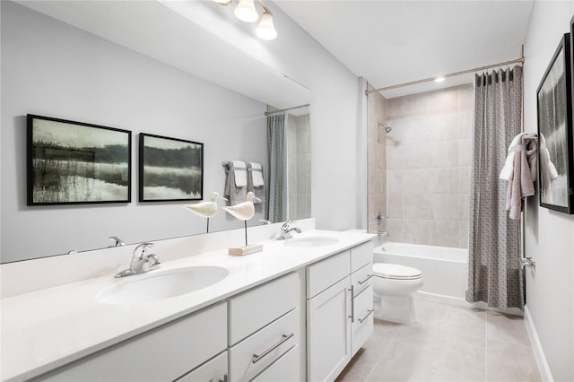 full bathroom featuring tile patterned flooring, shower / bath combination with curtain, vanity, and toilet