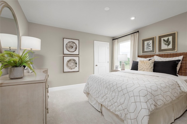 bedroom featuring light carpet