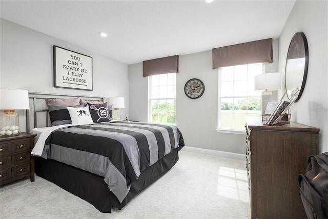 bedroom featuring light colored carpet