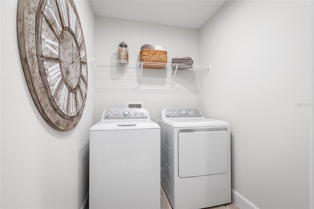 laundry area with independent washer and dryer