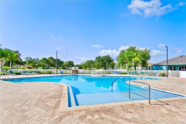 view of swimming pool featuring a patio