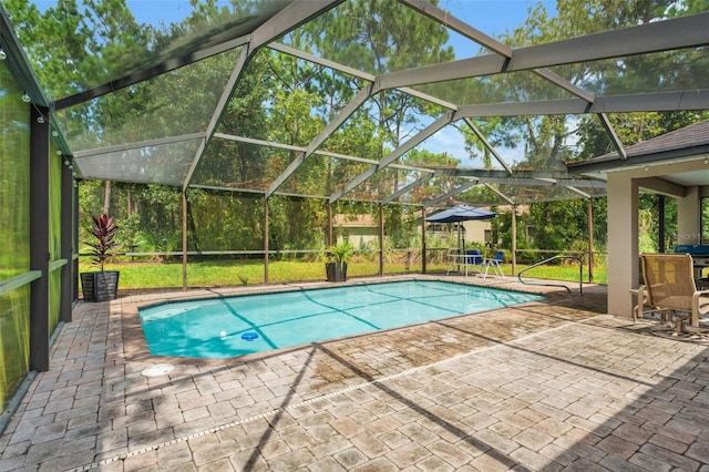 view of pool featuring a patio and glass enclosure