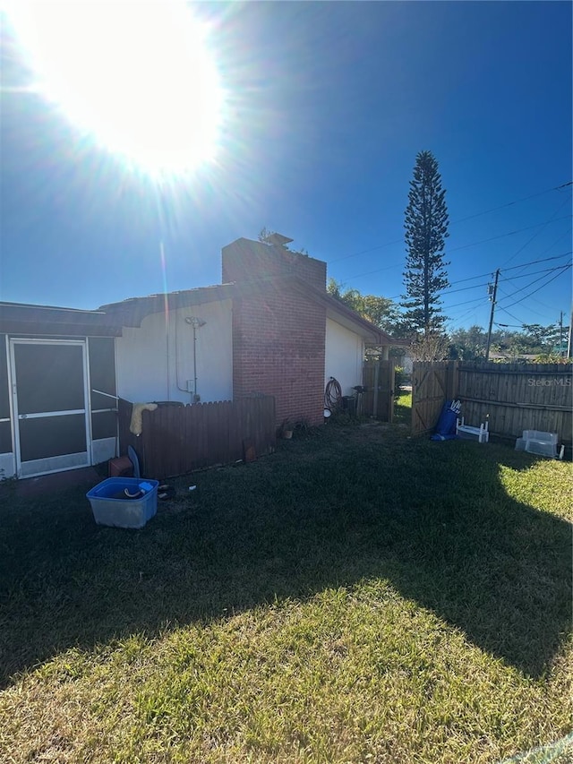 view of home's exterior with a lawn