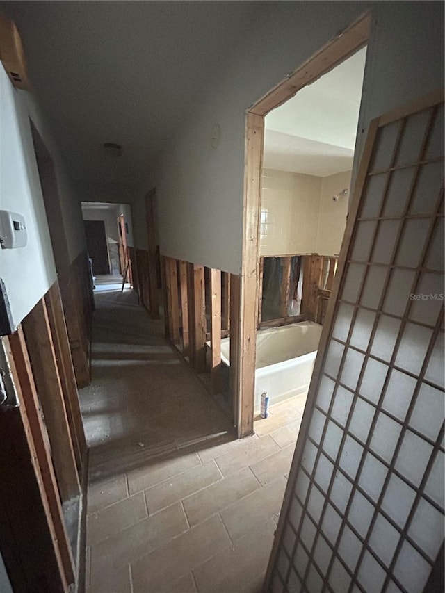 hallway featuring tile patterned floors