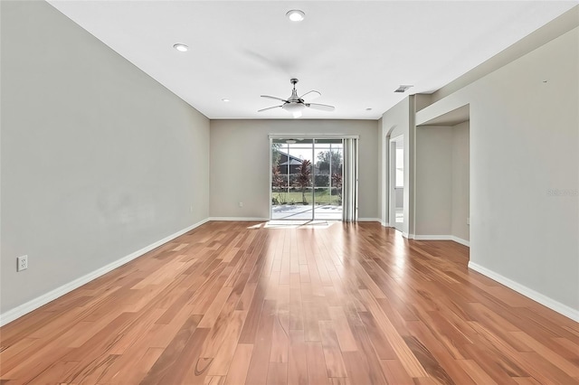 unfurnished room with ceiling fan and light hardwood / wood-style floors