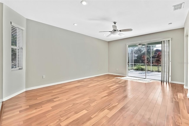 unfurnished room with ceiling fan and light wood-type flooring