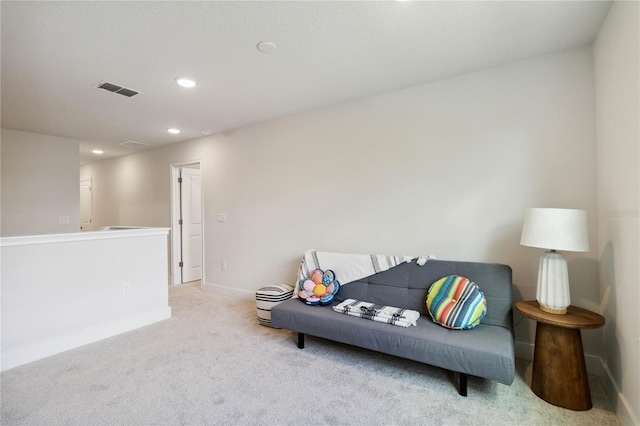 living area featuring light colored carpet