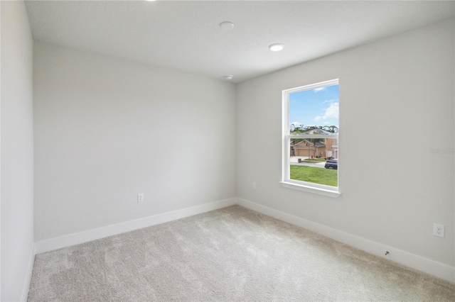 unfurnished room featuring carpet floors