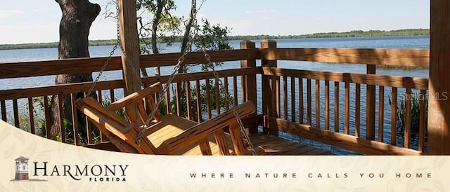 wooden terrace with a water view