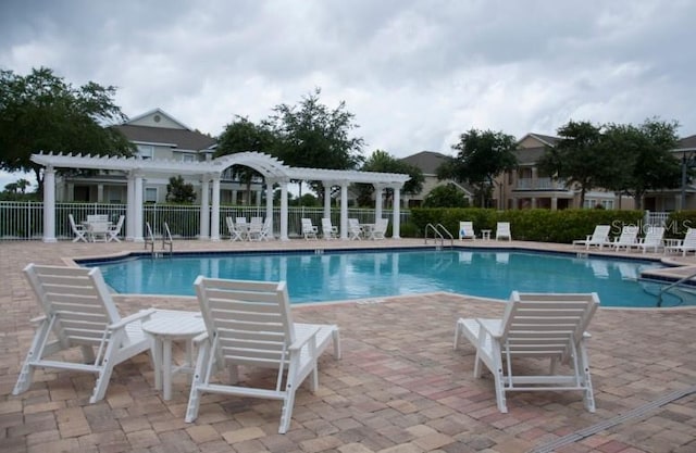 view of pool featuring a pergola and a patio area