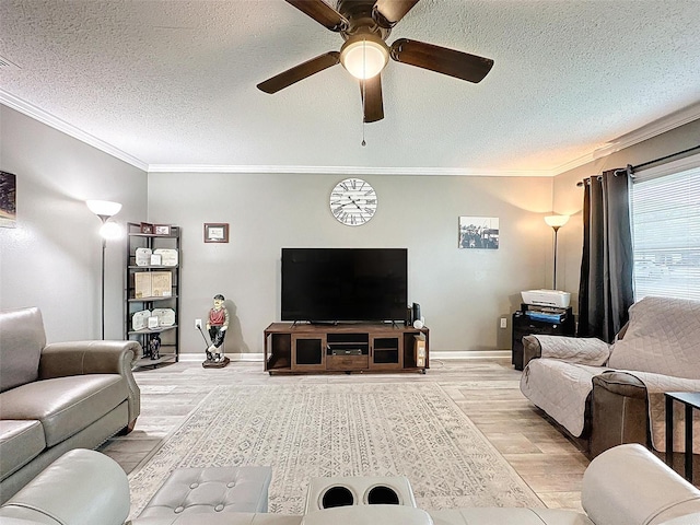 living room featuring a textured ceiling, light hardwood / wood-style flooring, ceiling fan, and ornamental molding