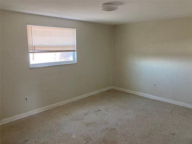 spare room featuring carpet