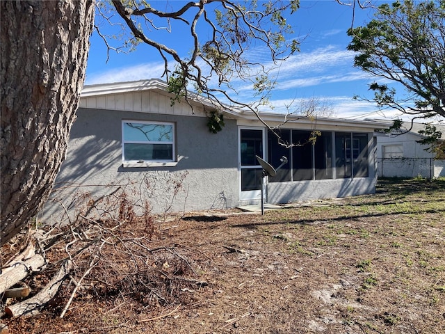 rear view of house with a sunroom