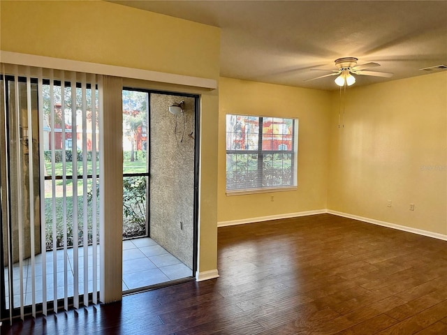 entryway with ceiling fan and dark wood-type flooring