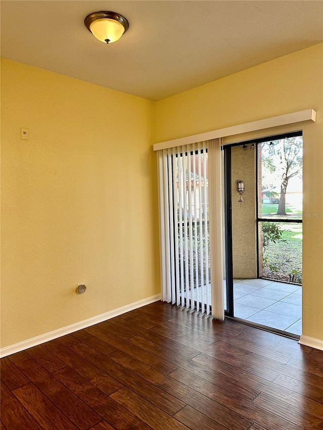 unfurnished room featuring hardwood / wood-style floors